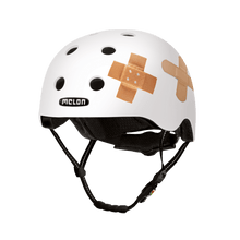 Load image into Gallery viewer, Melon Helmets white helmet with printed bandages designed for skateboarding, biking, scooter, and commuting