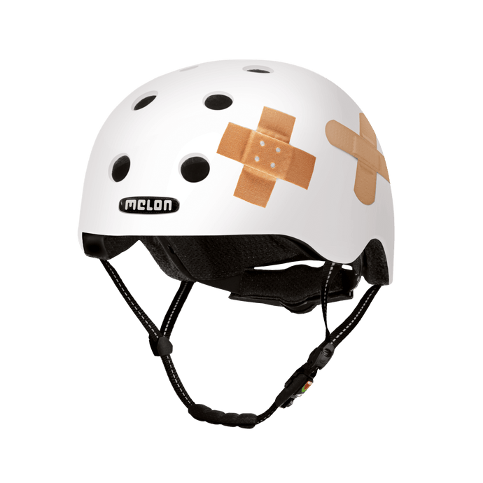 Melon Helmets white helmet with printed bandages designed for skateboarding, biking, scooter, and commuting